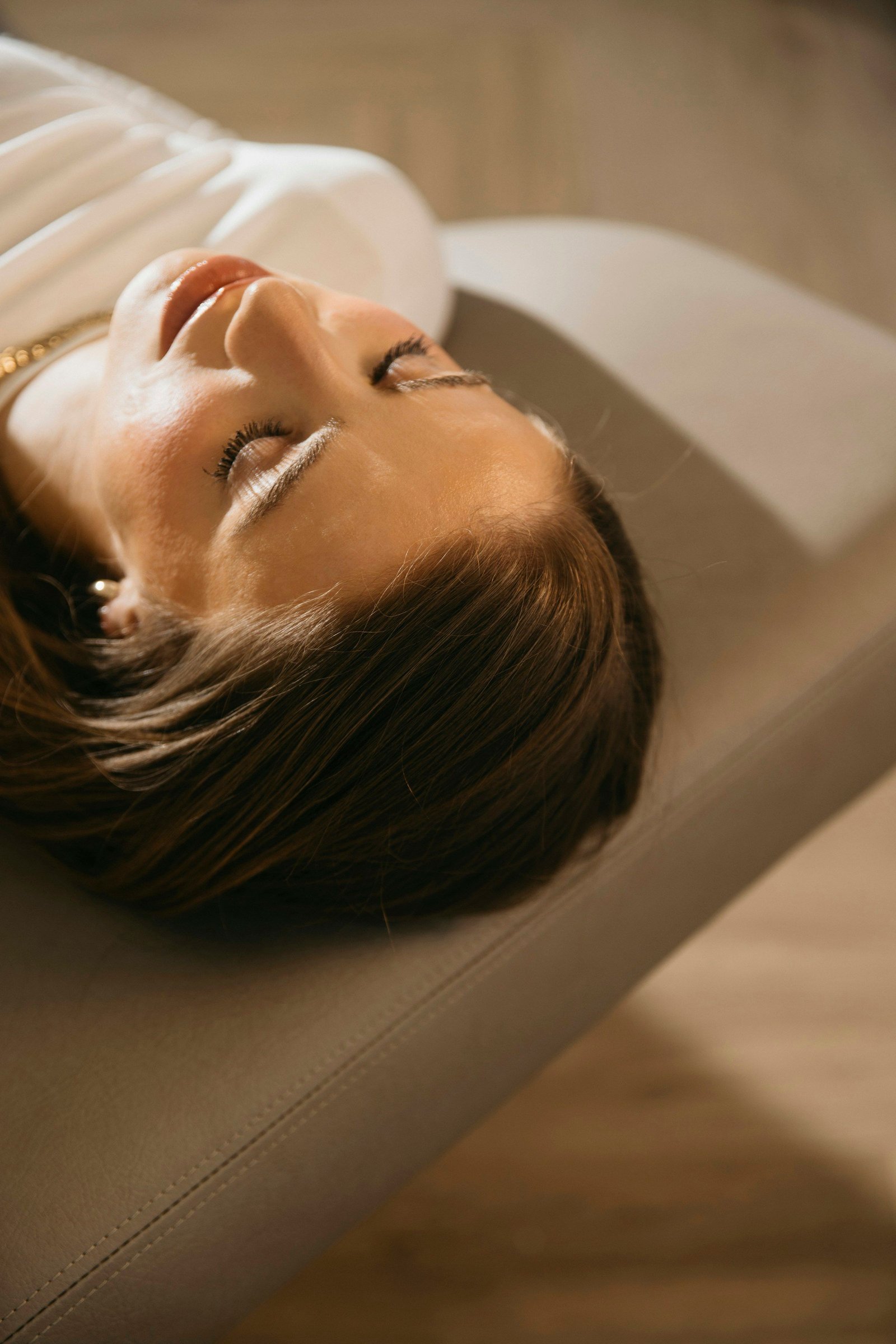 Guest resting with eyes closed during a treatment