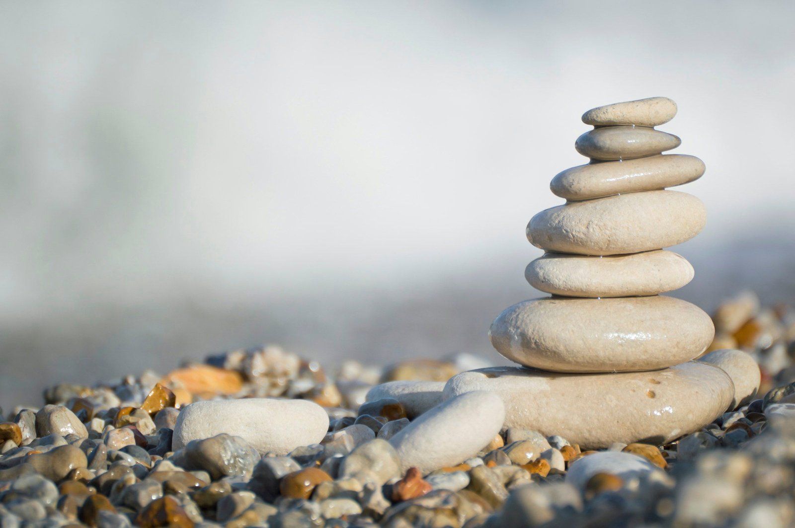 Smooth stacked stones on a pebble shore